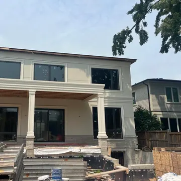 Stucco and natural stone exterior detail