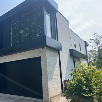 Stucco work in progress — base coat and mesh stage