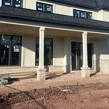 Stucco and natural stone exterior detail